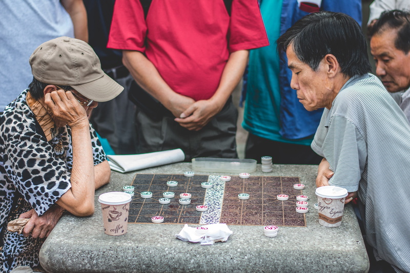 table, men, beside, two, playing, young adult, women, young women, group of people, people, relaxation, persons, leisure activity, arts culture and entertainment