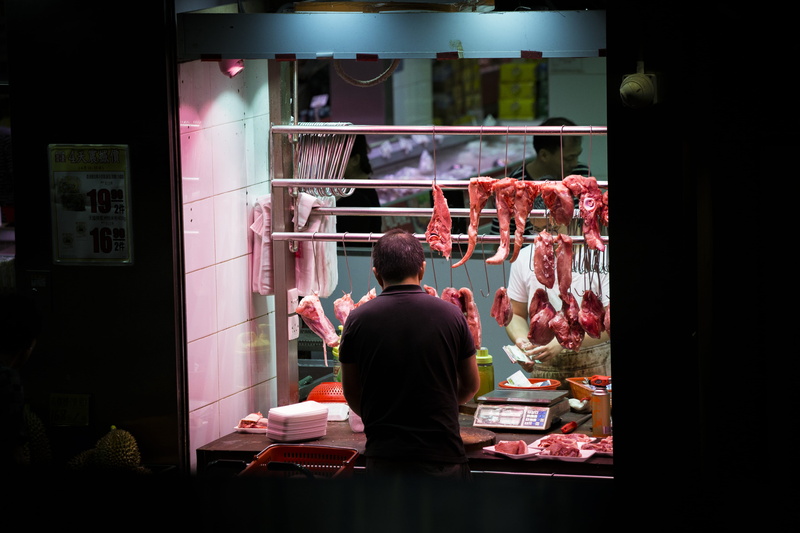 front, standing, man, for sale, fresh, street, marketplace, butcher, men, meat shop, rear view, real people, waist up, choice, hanging, meat, butchery