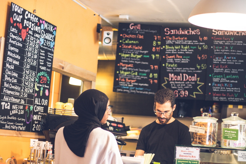 muslim, text, refreshment, real people, coffee shop, lifestyles, café, girl, two people, communication, business, black, occupation, service, barista, restaurant