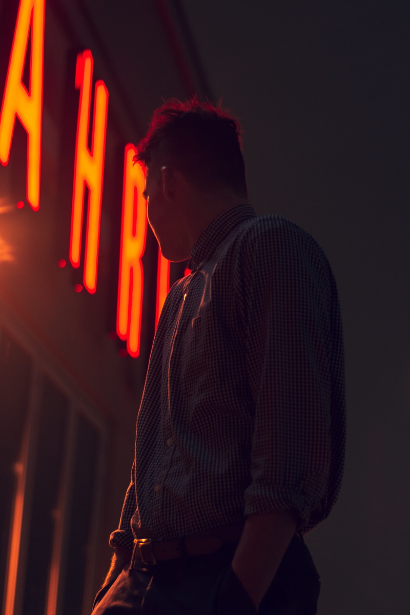 charlotte, neon, sleeve, clothing, leisure activity, putting, night light, person, communication, moody, indoors, light, young men, man, handrail, adult