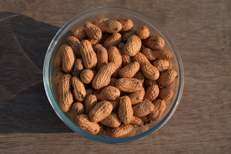 food, nut - food, nut, bowl, high angle view, wellbeing, healthy eating, table, food and drink, abundance, wood grain, indoors, brown, freshness, no people