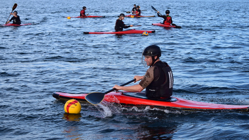 ball game, ball, water, canoeing, kayak, aquatic sport, group of people, men, nautical vessel, nature, oar, safety, floating on water, waterfront, transportation