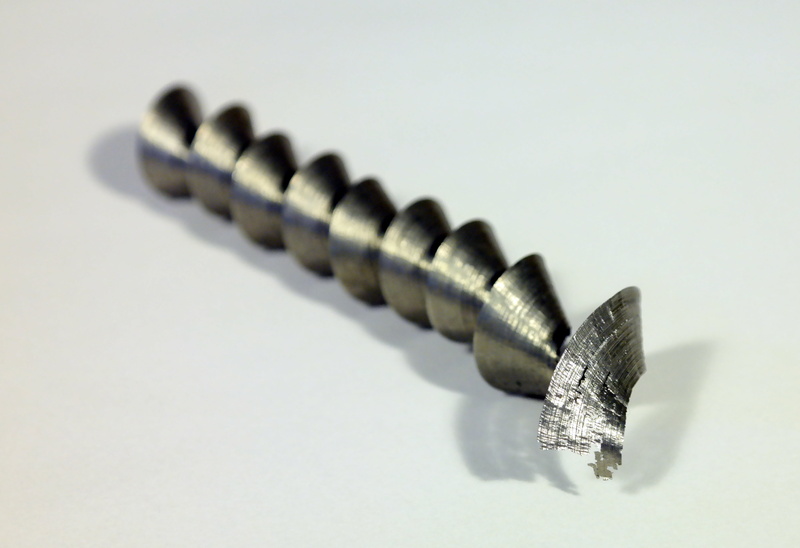 copy space, silver colored, high angle view, work tool, shadow, simplicity, spiral, alloy, single object, no people, selective focus, iron, metal shavings