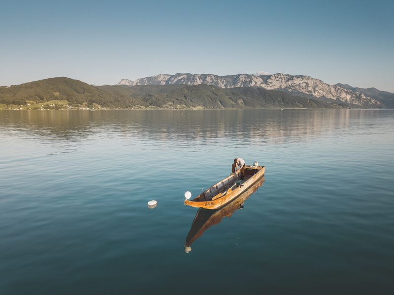 animal, scenics - nature, lake, mountain, non-urban scene, travel, summer, animals in the wild, sky, nautical vessel, one animal, outdoor, fisherman, transportation