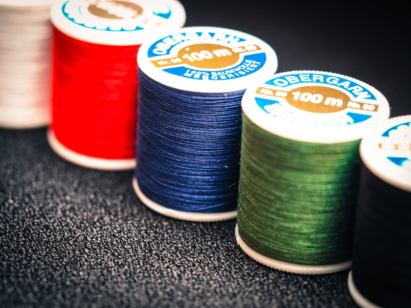 sewing accessories, house work, focus on foreground, craft, textile, photography, thread spool, sew on, indoors, high angle view, sew, hand labor, yellow
