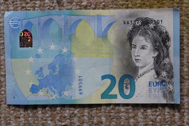 wall - building feature, blue, female likeness, human representation, paper currency, mural, business, indoors, representation, finance, text, male likeness