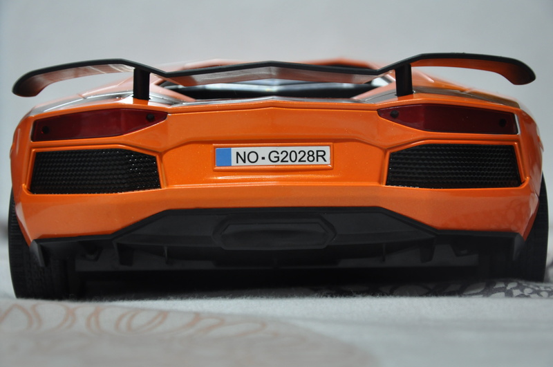 racecar, still life, no people, mode of transportation, technology, white background, power, decker, land vehicle, motor vehicle, indoors, orange color