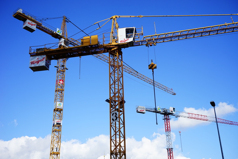 urban Scene, technology, outdoors, low angle view, industrial equipment, yellow, white, load lifter, engineering, crane - Construction Machinery, work
