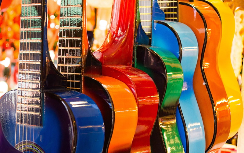 multi colored, in a row, amusement park, reflection, large group of objects, amusement park ride, order, arts culture and entertainment, guitar, indoors