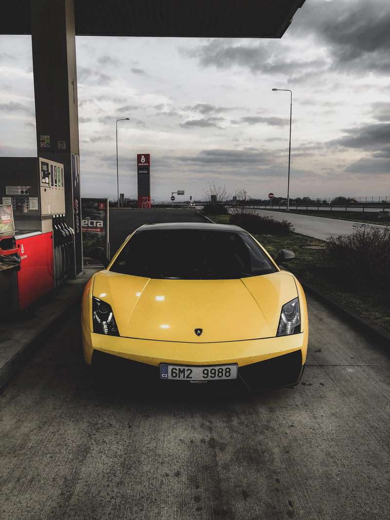 transportation, car, motor vehicle, land vehicle, czech, day, outdoors, architecture, communication, cloud - sky, sky, lamborghini gallardo, street, text