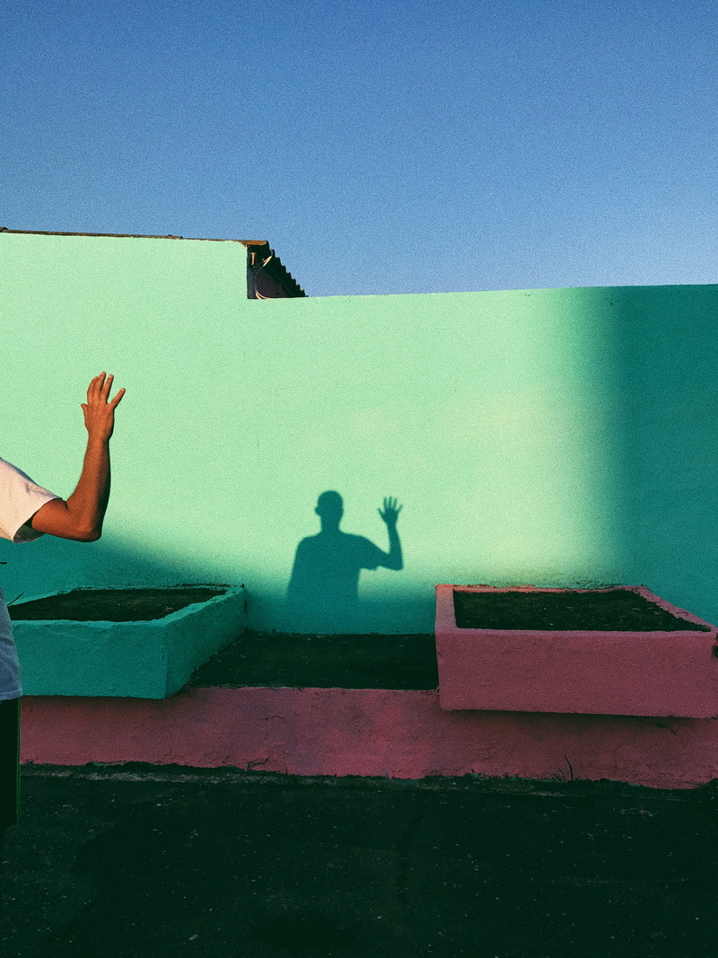 hello, teal, boy, a little pink, blue, sitting, wall, waving, lifestyles, shade, paint, outdoors, people, sport, 4K, men, caucasian Ethnicity, sunlight