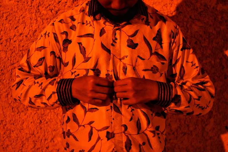 prison, person, apparel, sign, orange color, people, batik, 5K, red, jacket, front view, real people, warning sign, adult, human body part, coat, human hand