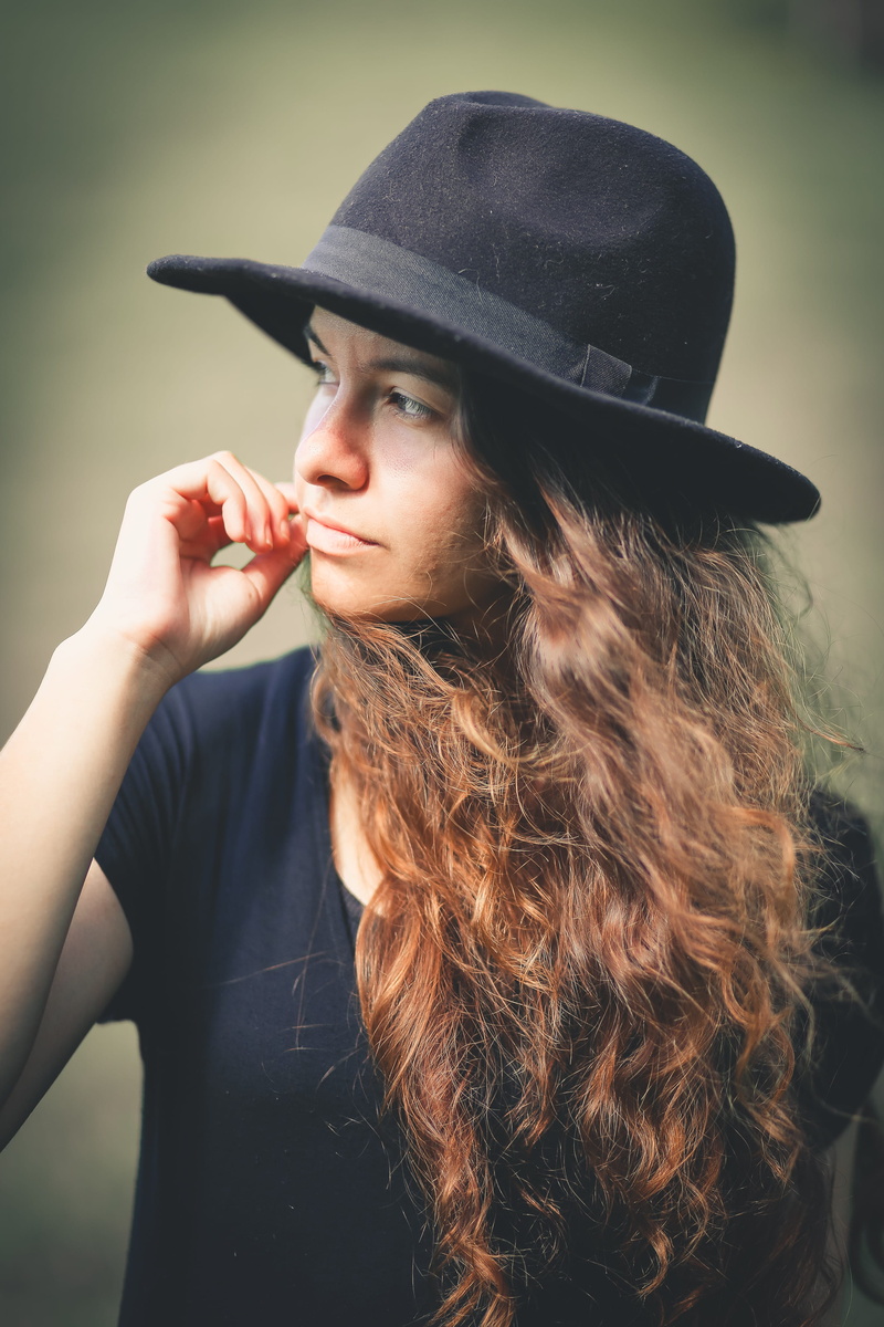 sun hat, 4K, portrait, looking, beautiful woman, human, long hair, handgun, lifestyles, wearing, looking away, black, weapon, outdoors, one person, young women