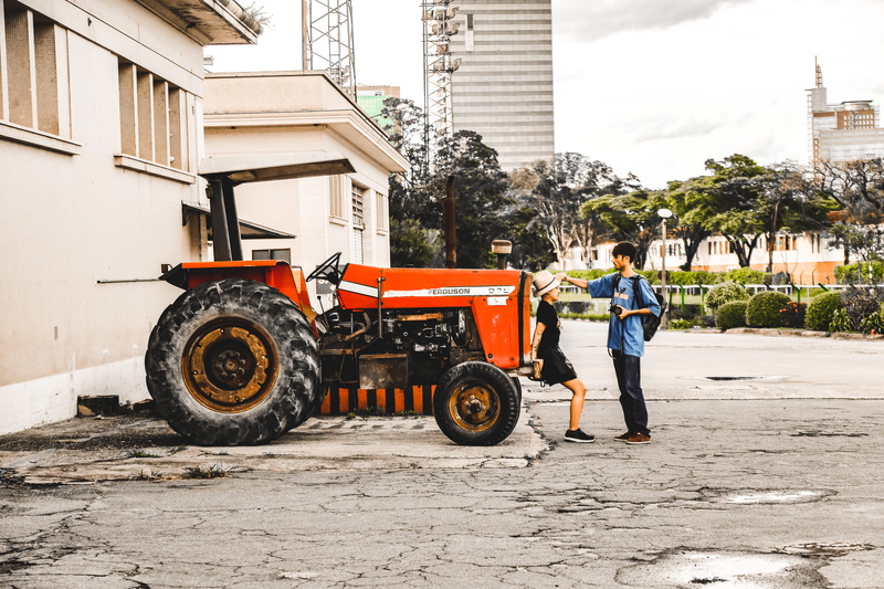 outdoors, vehicle, condo, full length, transportation, spire, housing, clothing, land vehicle, machine, snowplow, street, nature, city, footwear, men, front