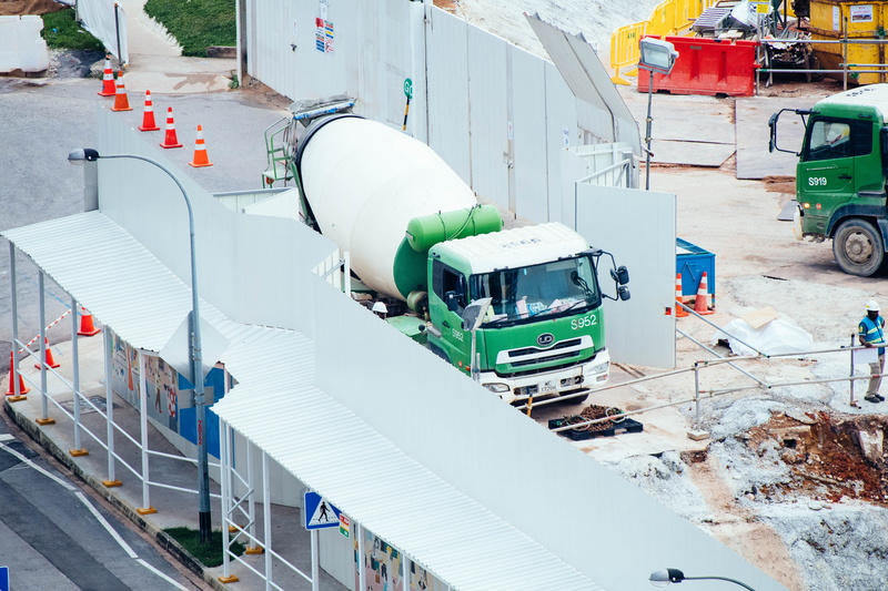 poster, building exterior, mode of transportation, cement, nature, worker, structure, mixer, motor vehicle, building, snowplow, day, high angle view, build