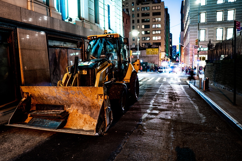 illuminated, rain, light, construction industry, wet, built structure, traffic light, outdoors, downtown, the way forward, tractor, human, road, architecture