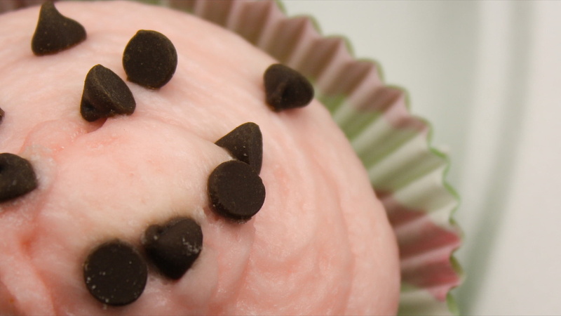 black color, white color, still life, body part, close-up, food, indoors, toy, dessert, icing, chocolate, one person, art and craft, creativity, pink, human body part