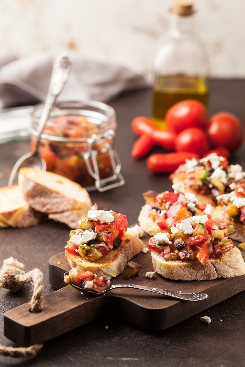 preparation, wood - material, italian food, indoors, chopping board, freshness, spoon, dairy product, olive oil, recipe, dark, focus on foreground, studio shot