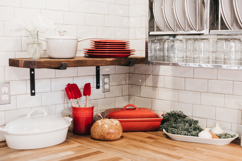kitchen utensil, wood, indoors, red, basket, mixing bowl, domestic bathroom, ingredients, table, container, pottery, plate rack, hardwood, domestic kitchen