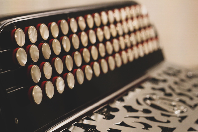 no people, text, accordion, equipment, large group of objects, zoom, in a row, focus on foreground, selective focus, detail, artist, 5K, baking sheet