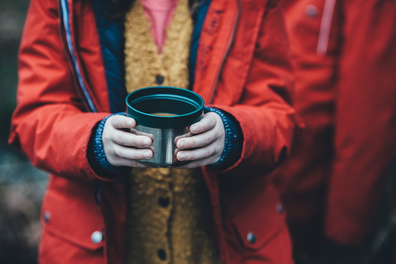 focus, jacket, hot drink, coat, people, food and drink, container, adult, standing, green, rain coat, plastic, childhood, hold, soup, clothing, front view