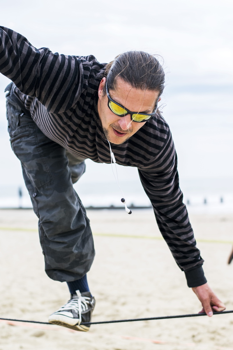 front view, real people, focus on foreground, portrait, bandw, bournemouth beach, young men, bournemouth, outdoors, stunt, 5K, bending, black and white