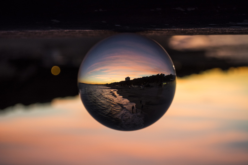 shape, bournemouth, sky, beauty in nature, ball, focus on foreground, sunset, crystal ball, no people, water, close-up, transparent, geometric shape, upside down
