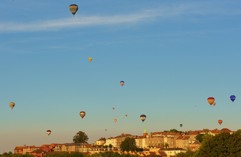 britain, building exterior, Bristol, mode of transportation, freedom, blue, outdoors, multi colored, parachute, england, environment, sky, mid-air, air vehicle