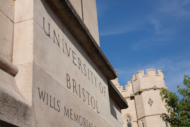 architecture, sky, shield, building exterior, historically, outdoors, wall - building feature, tower, university, neogothic, built structure, travel, bristol