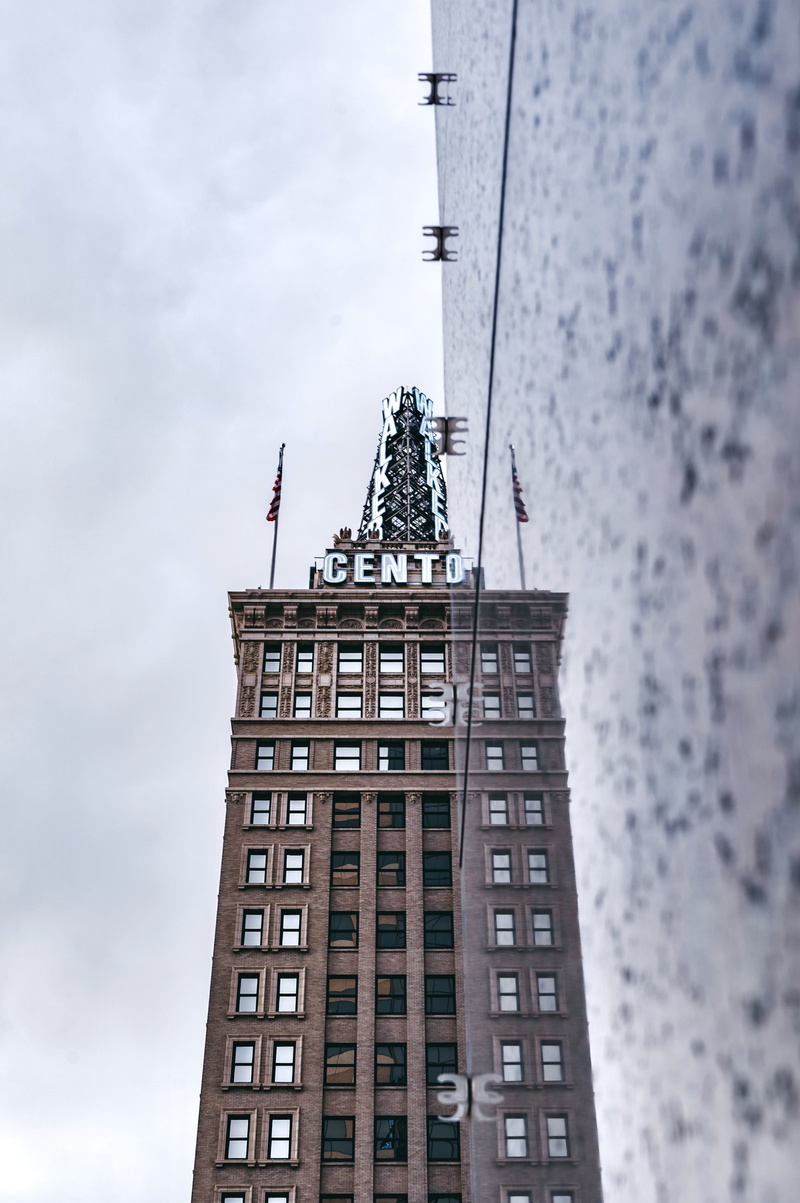 tall - high, brown, cento, symbol, flag, office, city, low angle view, united states, day, window, architecture, outdoors, building exterior, built structure