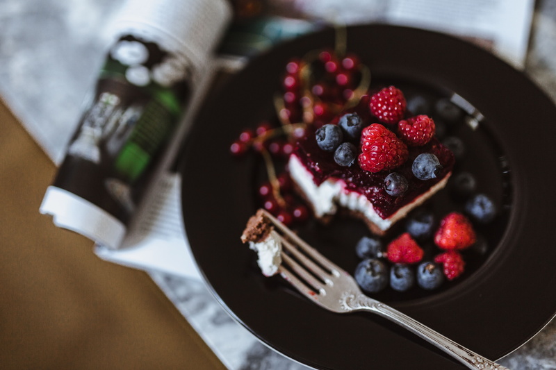 eating utensil, baked pastry item, breakfast, cheese cake, raspberries, temptation, blueberries, ripe, berry fruit, chocolate cake, food and drink, table