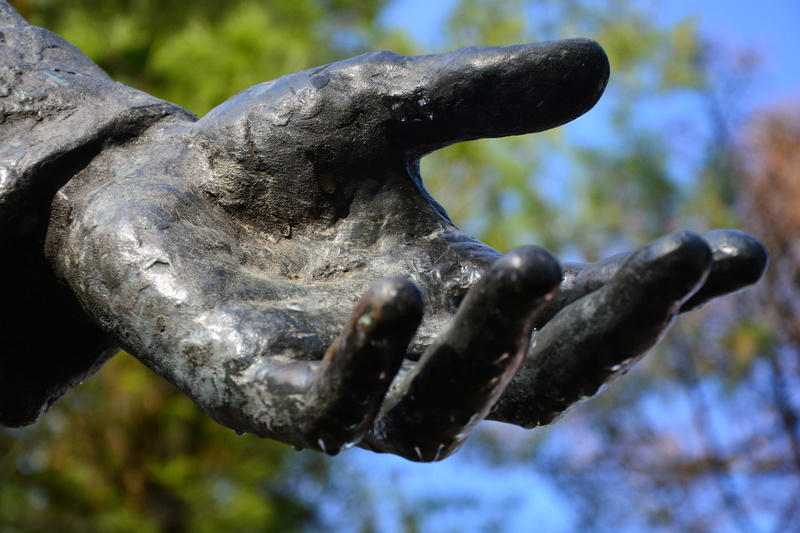 light, statue, nature, close-up, human representation, water drop, craft, outdoors, hand, focus on foreground, no people, 5K, bargain, representation
