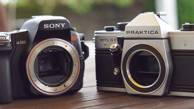 camera, laundromat, indoors, focus on foreground, no people, text, equipment, appliance, slr, household equipment, interchangeable lenses, photographic