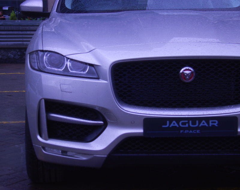 rma motors, automobile, high angle view, retro styled, 4K, jaguar, car, text, motor vehicle, stationary, western script, no people, cars, outdoors, nairobi