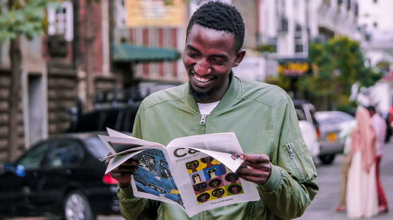 outdoors, kenyan, looking at camera, man, architecture, male, emotion, street, front view, nairobi, standing, happiness, young adult, men, kenya, black man