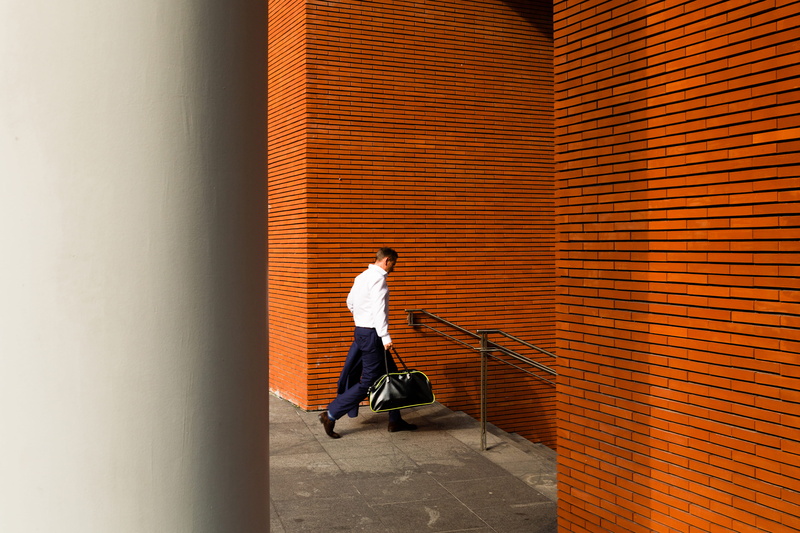 4K, spain, travel, male, bilbao, side view, orange, built structure, bag, stairs, stair, steps, modernism, building, day, orange color, holding, one person