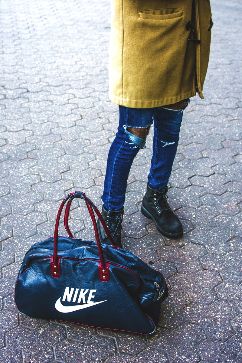 Nike, day, transportation, jeans, body part, duffel, road, person, people, men, travel, Style, walking, bag, leisure activity, real people, outdoors, street