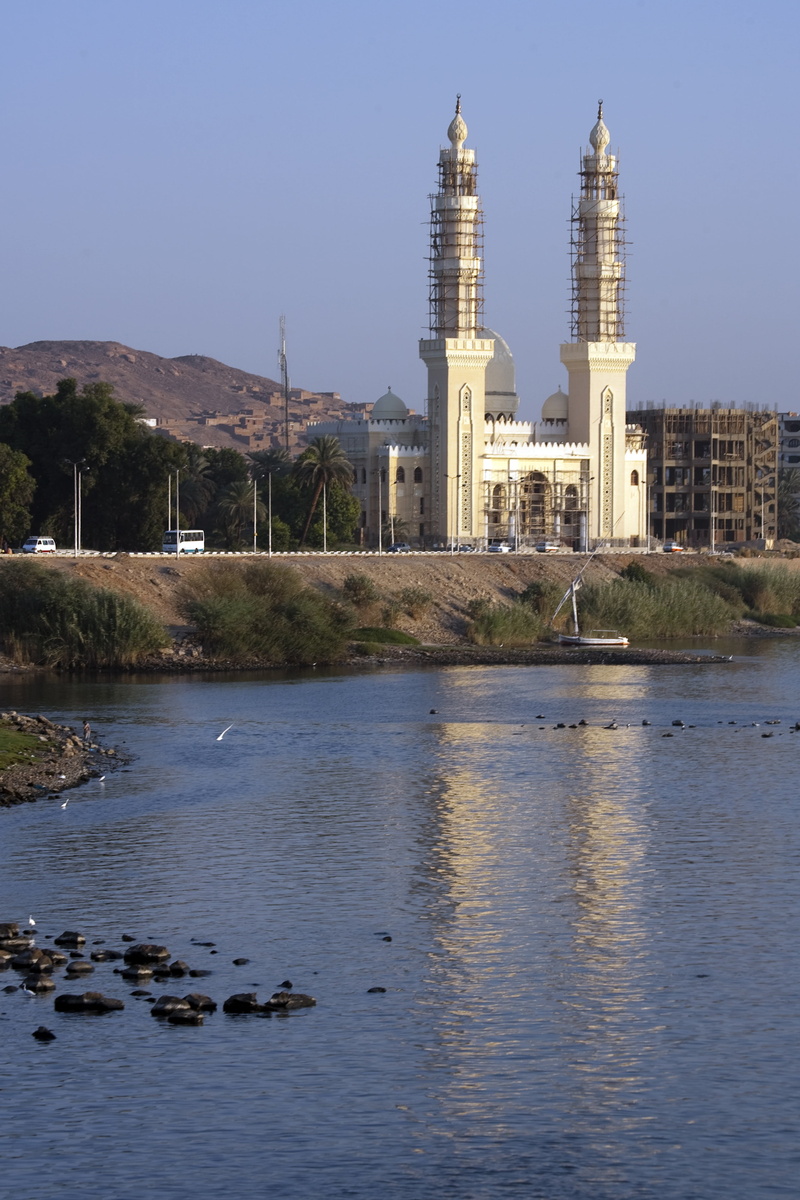 architecture, outdoors, building exterior, nature, day, construction, place of worship, aswan, built structure, mosque, sky, timber scaffolding, religion