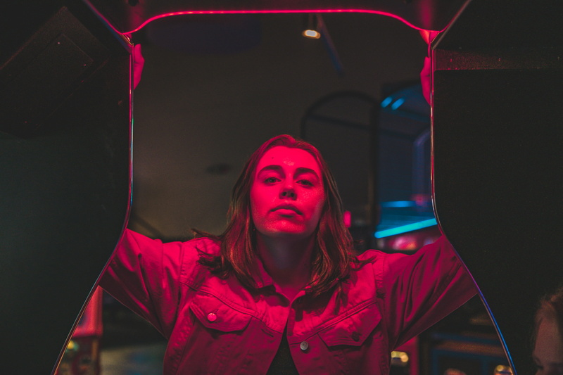 neon refect, headshot, standing, indoors, refection, beautiful woman, night, illuminated, girl, one person, hood, hooded shirt, 2K, portrait, front view