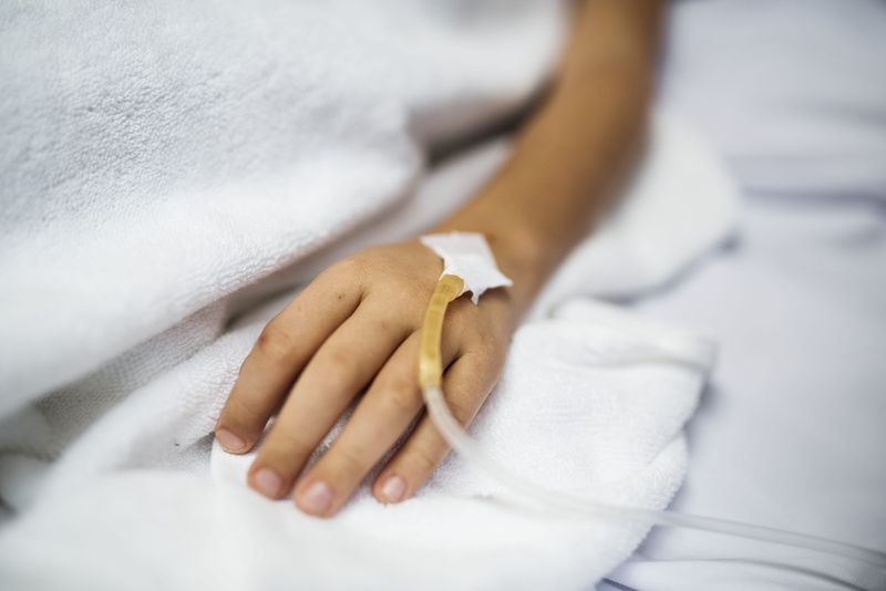 clothing, jewelry, illness, fingernail, white color, kid, healthcare, youth, bed, sick, midsection, left, luxury, body part, bathrobe, close -up, injected