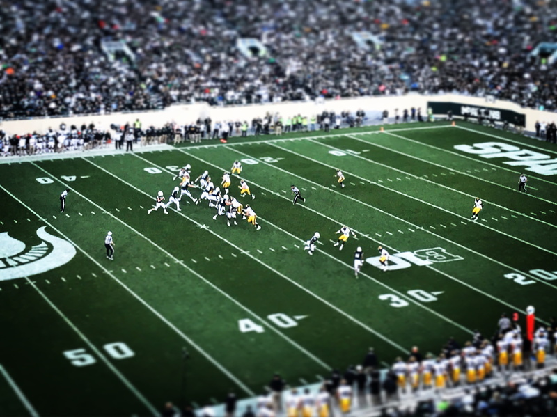 outdoors, grass, photography, american, players, competition, team sport, real people, athlete, tilt-shift, large group of people, aerial, crowd, football