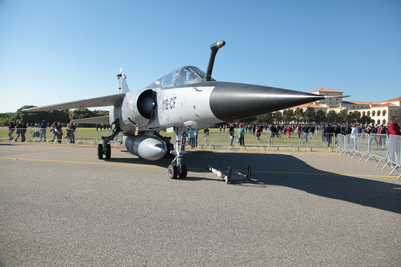 military, outdoors, hunting, aircraft, air vehicle, incidental people, day, sky, exhibition, sunlight, shadow, army, clear sky, airplane, large group of people