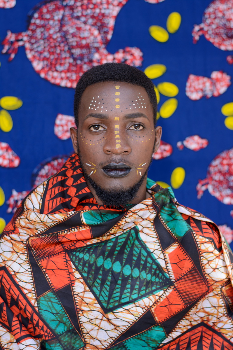 fashion model, face paint, blue, waist up, painting, attire, art, wear, african, wearing, costume, one person, 5K, lifestyles, real people, young adult