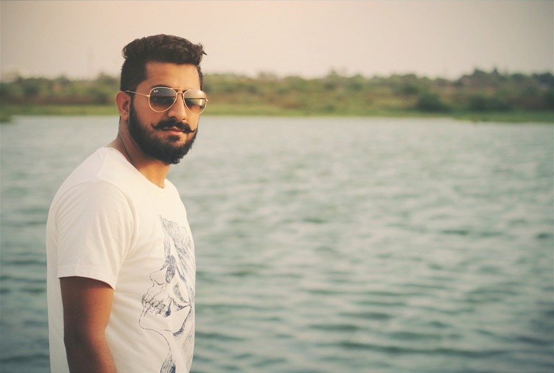 friendship, real people, man, fashion, focus on foreground, facial hair, emotions, black, handsome, leisure activity, sea, 2K, shirt, one person, wearing