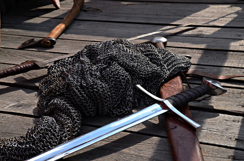 the middle ages, animal themes, panel, historical odtwórstwo, knights, hauberk, high angle view, chain wheels, sunlight, ax, chainmail, day, outdoors, no people