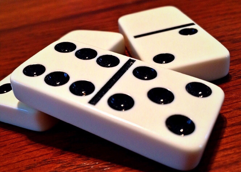 wood - material, leisure games, dice, luck, indoors, high angle view, leisure activity, dominoes, selective focus, still life, white color, strategy, gambling