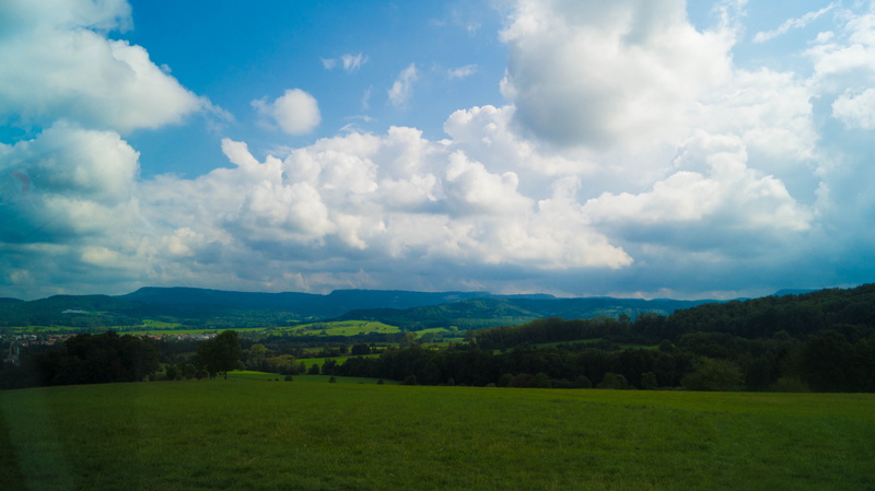 no people, trees, scenics - nature, blue, day, rolling landscape, meadow, mountains, field, green, nature, plant, green color, non-urban scene, tranquil scene