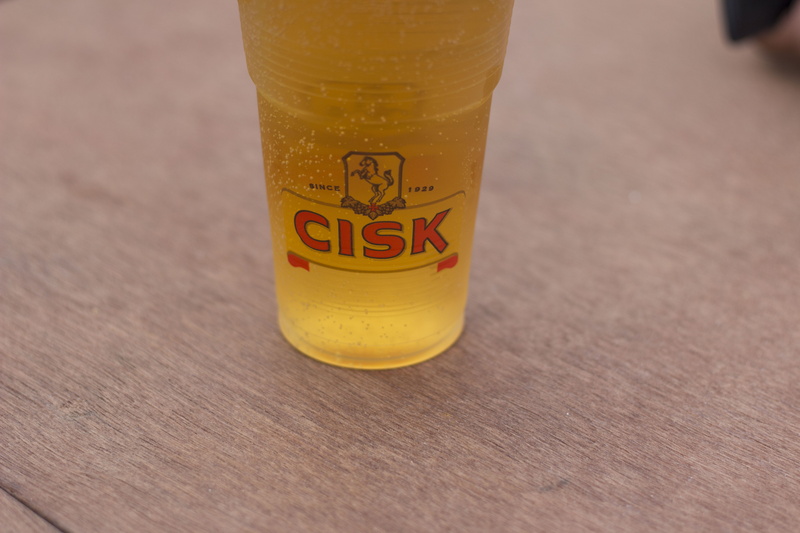 selective focus, food, food and drink, high angle view, beer bottle, single object, syrup, beverage, glass, yellow, text, western script, liquor, indoors