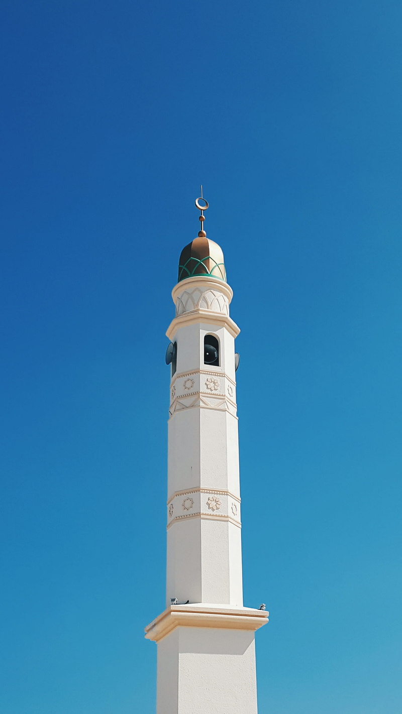 clear sky, outdoors, day, building, lighthouse, mailbox, copy space, bell tower, colored, beacon, steeple, blue sky, summer, sunlight, guidance, tower