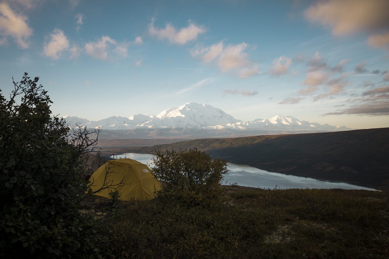tranquility, no people, tent, mountain peak, mountain, water, mountain range, non-urban scene, leisure activities, plant, camping, pine, remote, nature